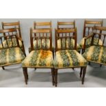 A set of eight George IV mahogany dining chairs, each with a reeded spindle turned support to the