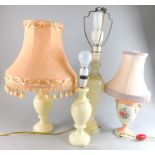 A pair of white marble table lamp bases, a similar alabaster example and a Crown Staffordshire two