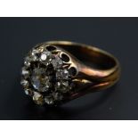 A diamond dress ring, with old mine cut stones, with larger central stone approx 0.1cts,