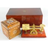 A miniature brass table scale with weights, 18cm high, tea caddy and a single rosewood caddy with