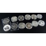 Twelve silver Fabulous Twelve collection coins, to include 2010 Chinese Panda silver coin, 2010