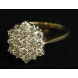 A 9ct gold dress ring, set in a floral cluster, with white stones, 2.3g all in, boxed.