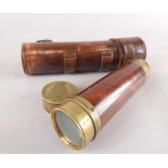 A brass and mahogany three draw telescope by Bate of London, in leather travelling case