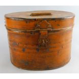 A late 19thC hat tin, painted brown of oval outline, 22cm high.