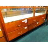 A vintage mahogany and glazed shop counter, with sliding doors above six drawers, 182cm wide.