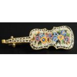 An Italian micro mosaic style cello brooch, in a fitted case.