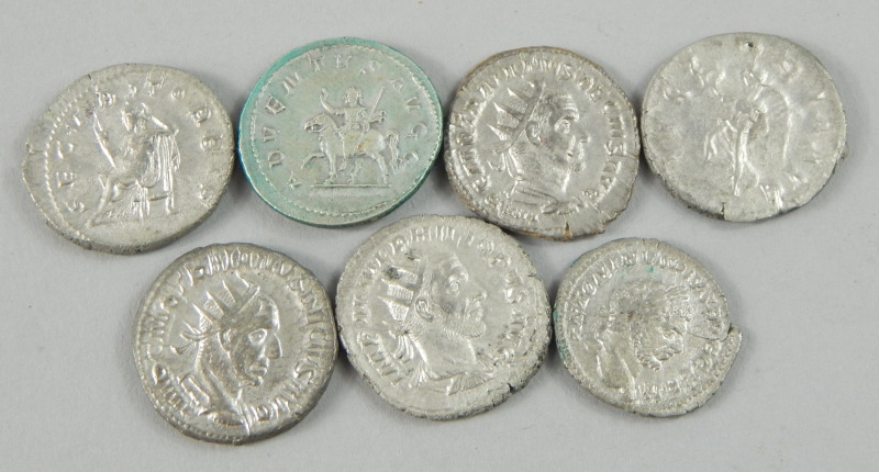 Seven replica Roman coins, cast with Julius Phillipus and Trajan Decius
