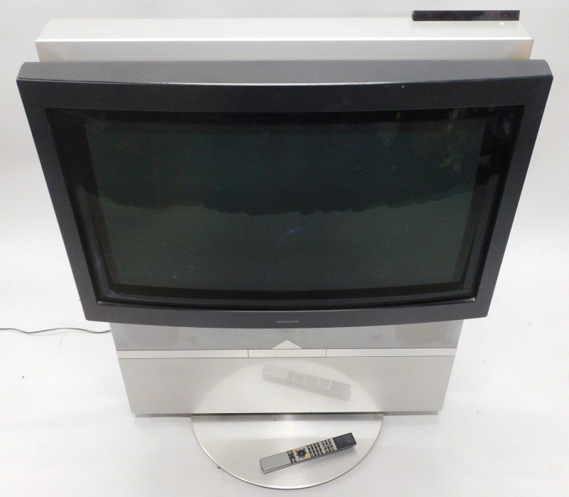 A Bang & Olufsen 30" television, on motorised stand with remote