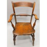 An Oxfordshire bar back Windsor chair, with a part turned rail, shaped arms, solid seat, on turned