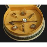 A mother of pearl set collar set, with bar brooch and collar studs, yellow metal, unmarked, boxed.