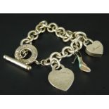 A Tiffany & Co. silver charm bracelet, with Tiffany & Co. mum padlock, Tiffany & Co. Italy enamel