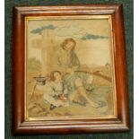 A 19thC woolwork picture, depicting a figure beside a cross, with a young child, two prints of