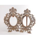 A pair of 19thC cast metal rococo design frames, each of pieced figural and floral scroll outline,