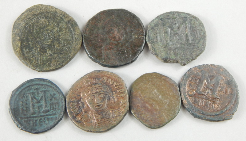 Seven Byzantine Follis style coins, bearing the bust of Justinian I and II etc.