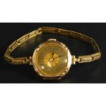 A ladies wristwatch, on expanding gold plated bracelet, with a yellow metal watch head, unmarked,
