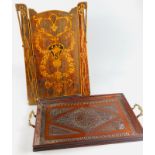 An early 20thC heavily carved tray, with brass handles and moulded gallery edge, 53cm wide, with a