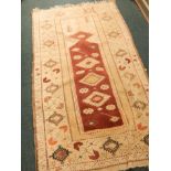 An Anatolian Turkey rug, with a design of medallions, etc, on a red ground, with one wide and two