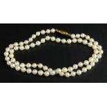A cultured pearl necklace, with yellow metal clasp, marked 375.