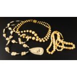 Three ivory and bone necklaces, to include an Art Deco ivory necklace, a bone elephant necklace, and