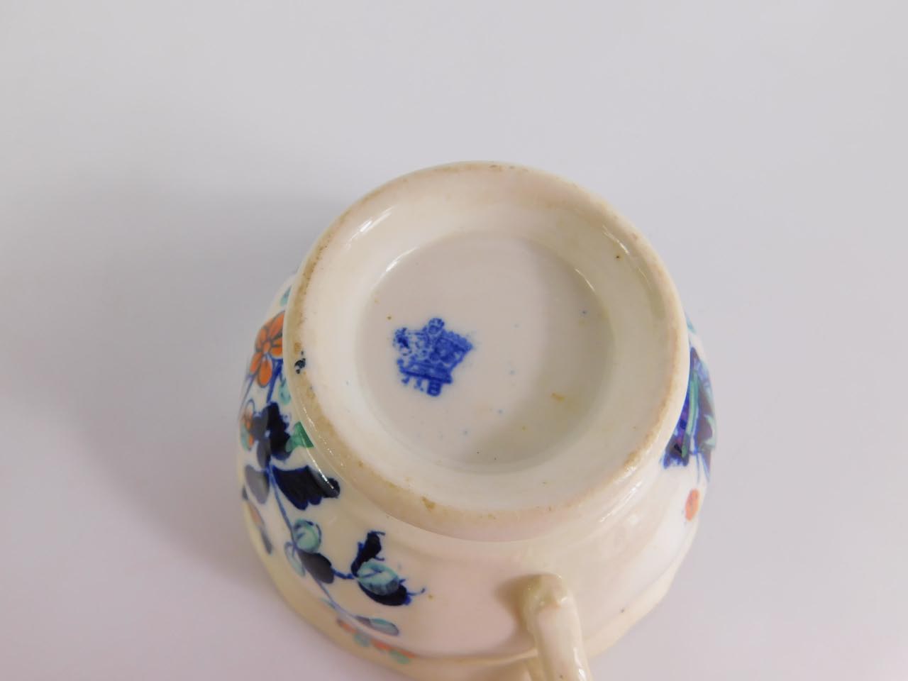 A Staffordshire mid 19thC part tea service imari decorated with flowers, comprising cream jug, bread - Image 2 of 3