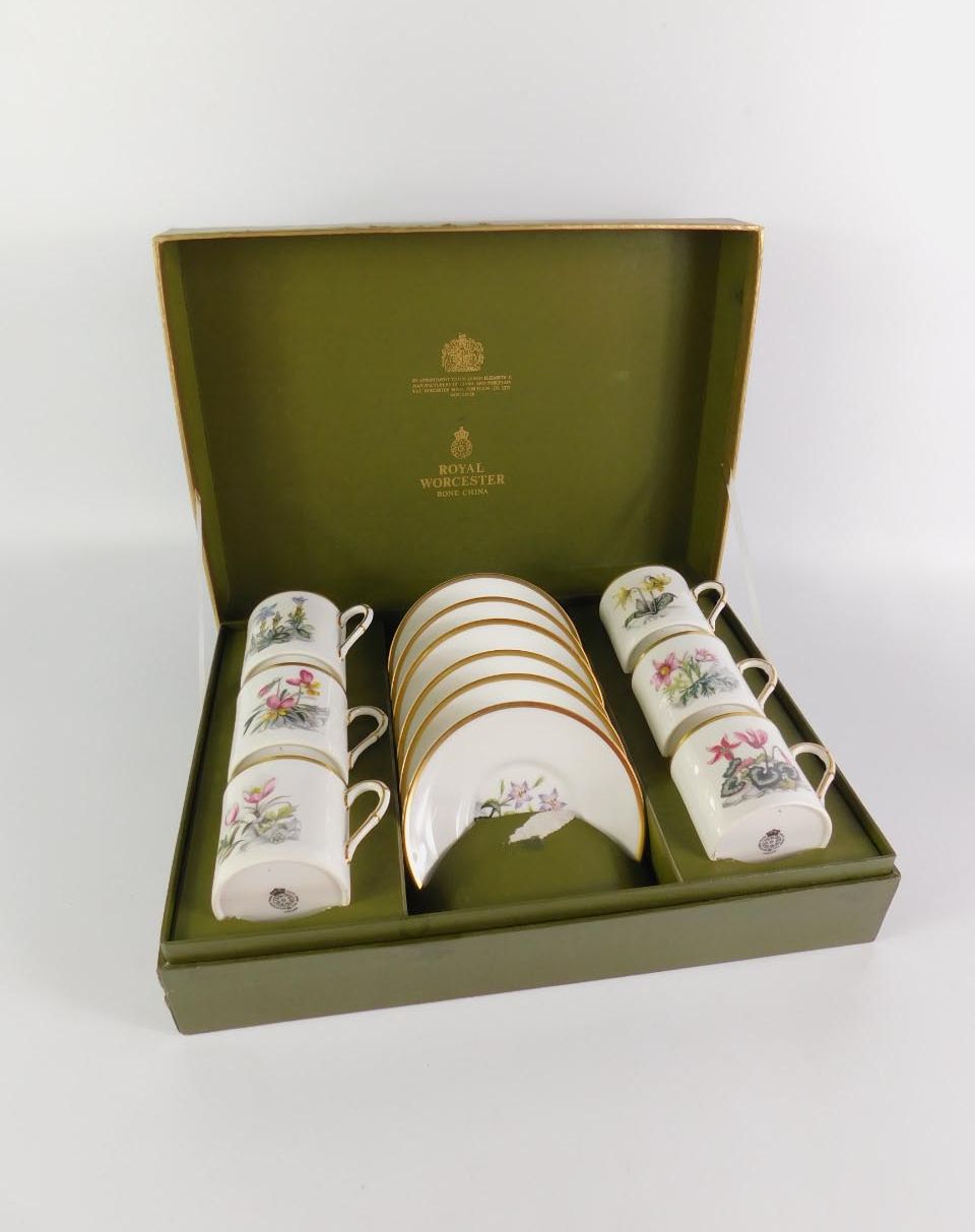 A Royal Worcester porcelain botanical part coffee service, comprising six cans and saucers, boxed.