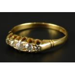 An 18ct gold diamond set dress ring, set with five tiny diamonds, 3g all in.