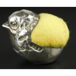 A George V silver pin cushion, modelled in the form of a chick, with later felt, Chester 1918, 5cm