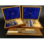 Two sets of early 20thC silver plated and ivory handled fish knives and forks, and a set of fish