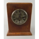 An oak mantel timepiece, the Swiss made silvered dial indistinctly stamped, 25cm high