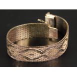 A white metal articulated ladies bracelet, stamped 925