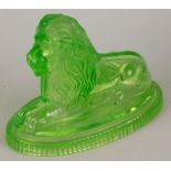 A Victorian John Derbyshire green moulded glass lion, lozenge registration mark to underside and