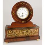 A 19thC French mahogany and brass inlaid mantel timepiece, the white enamel dial with Roman