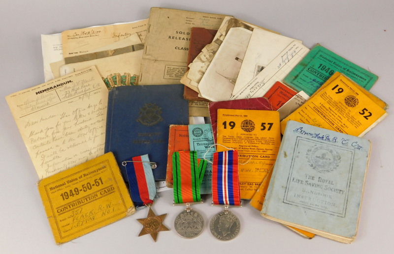 A collection of WWII medals and ephemera relating to a Private R W Flack, of The Bedfordshire and