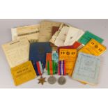 A collection of WWII medals and ephemera relating to a Private R W Flack, of The Bedfordshire and