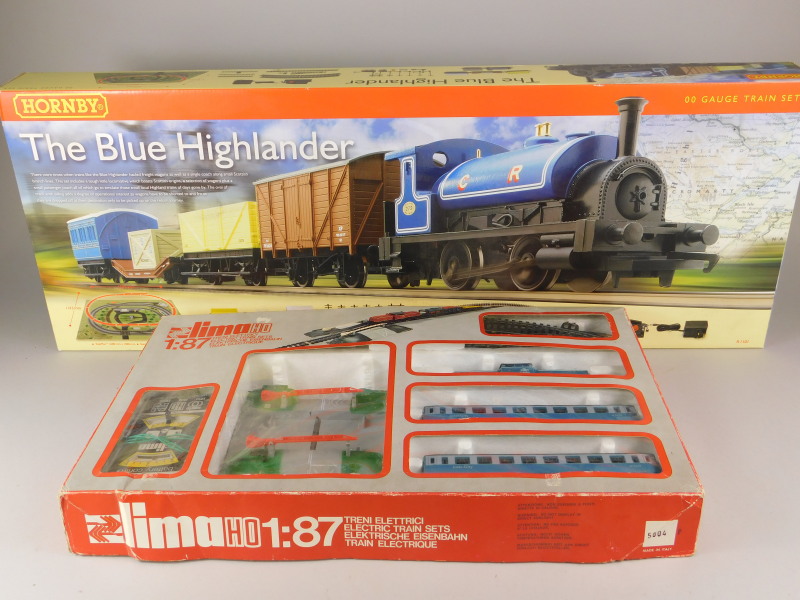 A Hornby Blue Highlander OO-gauge train set, and Lima HO-gauge electric train set, both boxed.