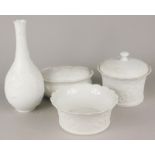 A collection of Kaiser white porcelain, to include a bottle shaped vase and a jar and cover.