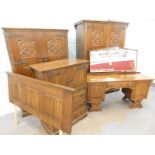 An Old Charm style bedroom suite, each piece carved with linen folds etc., comprising small