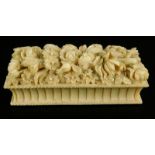 A late 19thC Chinese ivory box and cover, the hinged lid carved with flowers, leaves etc., the