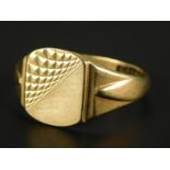 A 9ct gold dress ring, with half engine turn design shield, 4.1g all in.