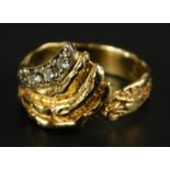 A dress ring, of bark design, formed in four rows, one set with three tiny diamonds, yellow metal,