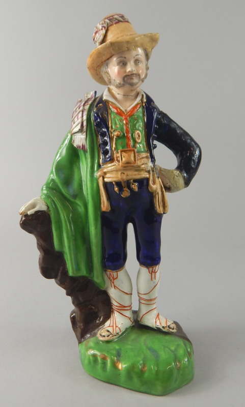 A ceramic figure, modelled in the form of a gentleman wearing continental dress, possibly Derby (
