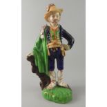 A ceramic figure, modelled in the form of a gentleman wearing continental dress, possibly Derby (