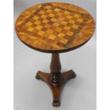 A William IV mahogany games table, with an inlaid chess board in bird's eye maple and rosewood, on a