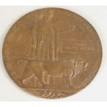 A First World war bronze death plaque or penny, awarded to a Joseph Slater Purves. Joseph Purves was