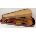 A late 19th/early 20thC violin, with two piece back, Stradivarius label, length of back 35.5cm and a