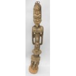 Tribal Art. A Dogon ancestor figure from Mali, the head facing away from the body, in typical style,