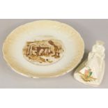 Two WWI ceramic items, an Arcadian china crested Tommy and His Machine Gun, and a plate after