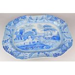 A 19thC Staffordshire blue printed meat dish, decorated centrally with a fortified castle, farmer,