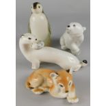 A collection of Russian porcelain animals, to include a stoat, lion cub, polar bear and a seated