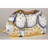 A Royal Crown Derby limited edition porcelain paperweight, the White Rhino from The Endangered